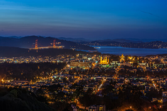 Beautiful scenic view of San Francisco city skyline and Golden Gate Bridge at night from Twin Peaks