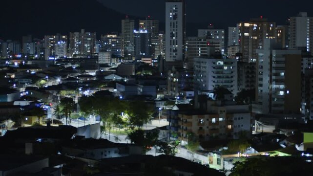 City of Praia Grande filled with transport at nigh. Brazil