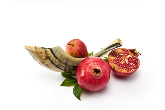 Shofar, apples, pomegranates symbolizing rosh hashanah holiday