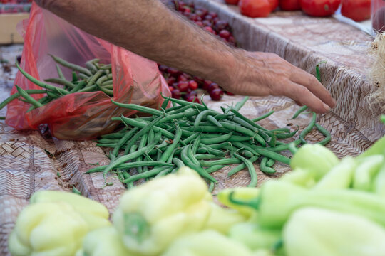 Fresh locally grown green beans displayed at a farmers market, natural seasonal produce and sustainable local food concept