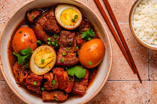 Braised pork belly and eggs. Traditional Southeast Asian cuisine