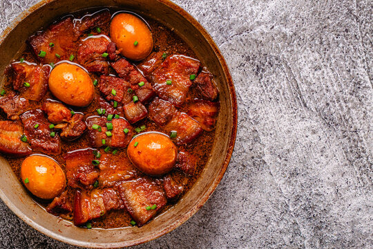 Braised pork belly and eggs. Traditional Southeast Asian cuisine