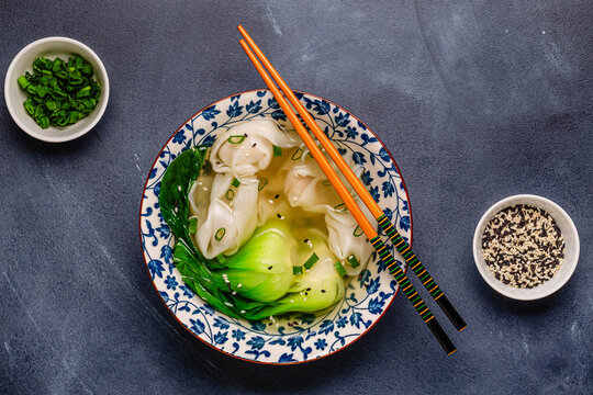 Soup with wontons and bok choy
