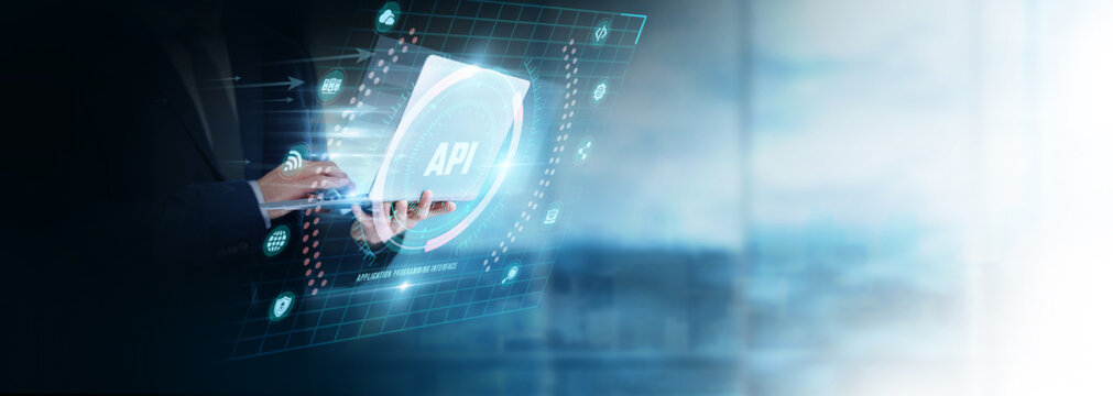 Businessman Using Laptop for Analyzing API Data. Managing software integration, improving application connectivity, developing digital services, and optimizing modern technology platforms.