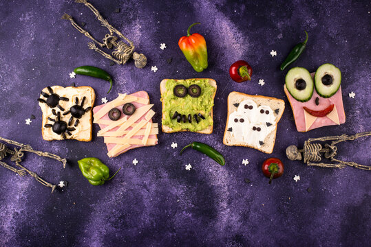 Halloween food for children. Funny scary monsters toasts