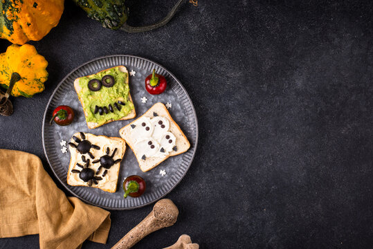 Halloween food for children. Funny scary monsters toasts