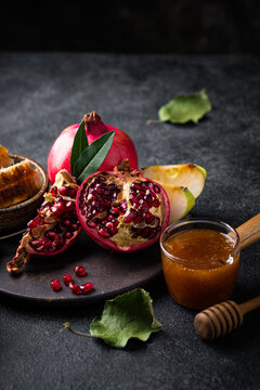 Rosh Hashana Jewish New Year concept with honey apple and pomegranate