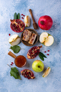 Rosh Hashana Jewish New Year concept with honey apple and pomegranate