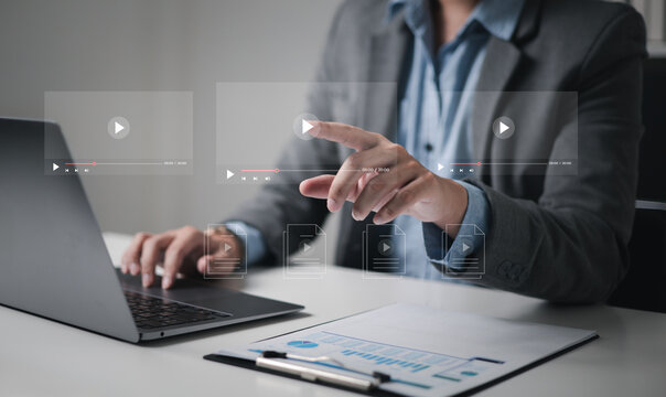 Businessman touching a virtual screen with his hands for online streaming watch videos on the internet online webinars internet education e-learning concept