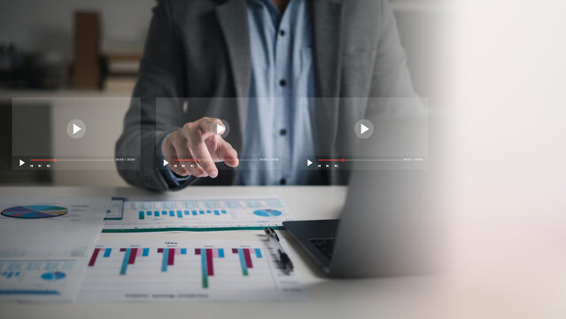 Businessman touching a virtual screen with his hands for online streaming watch videos on the internet online webinars internet education e-learning concept
