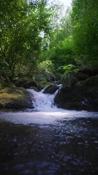 Fresh waterfall along the Salat river in Ariege department in southwest France. Trout fishing