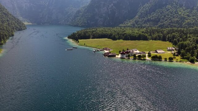 Aerial View Saint Bartholomew Church Austrian Alpine Lake

Drone footage reveals Saint Bartholomew church beside blue alpine lake and forested mountains, Austria, August 2026.
