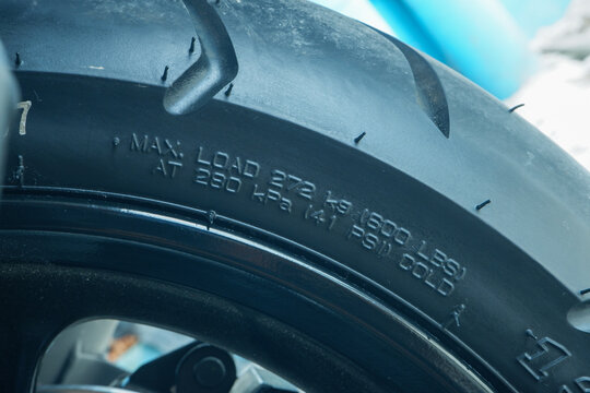 Motorcycle Tire Sidewall Close Up Showing Max Load Capacity and PSI Pressure Markings