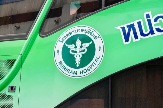 Close up of Buriram Hospital emblem and medical caduceus logo on green vehicle background , 5 Oct 2026 , Thailand