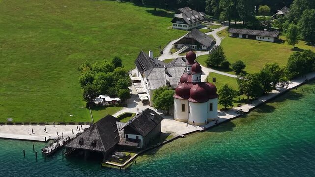 Aerial View Historic Saint Bartholomew Lakeside Church Austria

Drone footage captures iconic church architecture beside turquoise waters and green meadows, Austria, August 2026.
