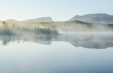 Fototapeta premium Sunrise lake landscape in autumn. Abisko national park in north of Sweden