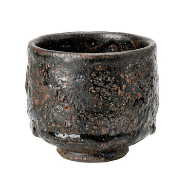Traditional japanese chawan teacup with rough texture and dark glaze on black background