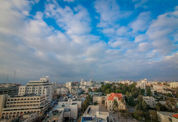 Obraz premium Dense Ramallah cityscape across rolling hills