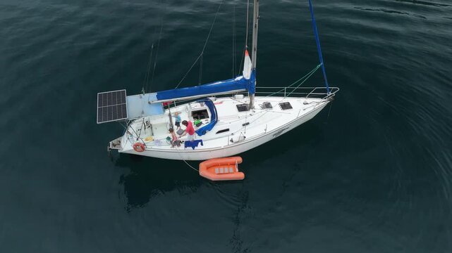 Aerial view of the sailing boat in the calm sea