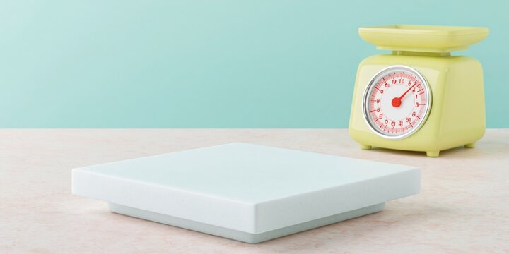 Minimalist white podium on a smooth surface for product display with a yellow kitchen scale in the background for health and diet concepts