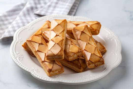 Traditional Italian Sfogliatine Glassate Glazed Puff Pastry Biscuits on Plate