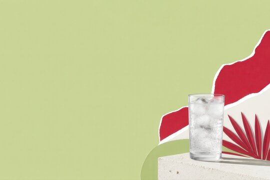 Iced Water Still Life with Tropical Accent on Pastel Green Background