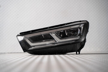 Modern LED car headlight isolated on white background © nayefhammouri