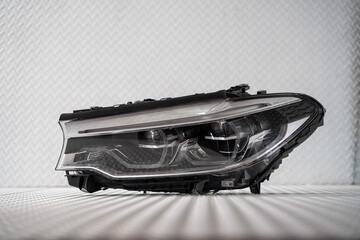 Modern LED car headlight isolated on white background © nayefhammouri