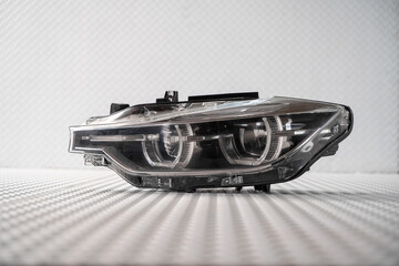 Modern LED car headlight isolated on white background © nayefhammouri