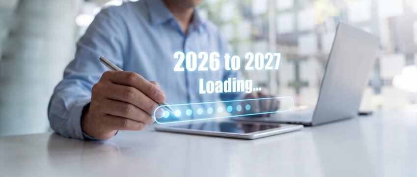 Professional businessman interacting with digital loading bar representing transition between years two thousand twenty six with interface indicating transition