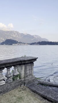 View of Lake Como and mountains from a historic site in Griante, Italy
