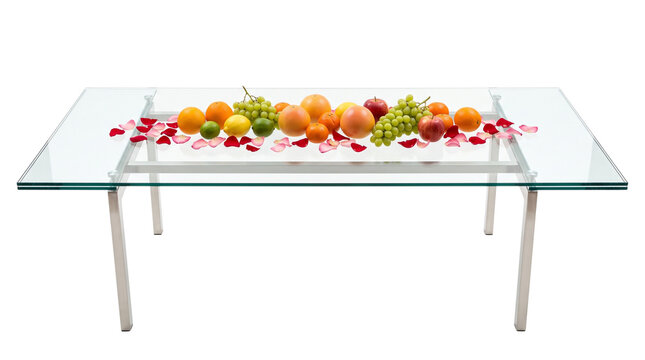 Modern glass dining table with fresh fruit centerpiece, elegant glass furniture with citrus and grapes, minimalist interior decor isolated PNG with Transparent Background