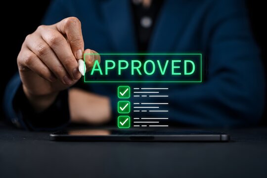 Approved loan application concept with digital checklist on smartphone and stylus, representing online lending, financial approval process, secure verification, and modern digital banking services.