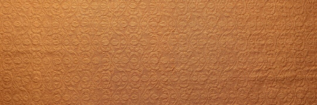 Textured brown paper towel surface, absorbent kitchen paper roll close up, embossed orange fiber pattern background
