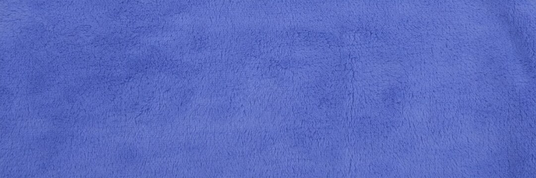 Cobalt blue suede leather texture, soft velvet fabric background, premium matte textile surface for fashion and interior design