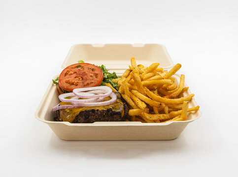 Burger and fries in a clamshell