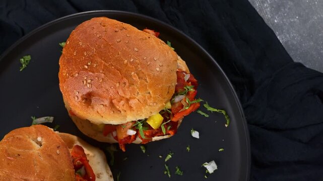 Overhead view of traditional Mexican torta sandwich with pork, pineapple and onion