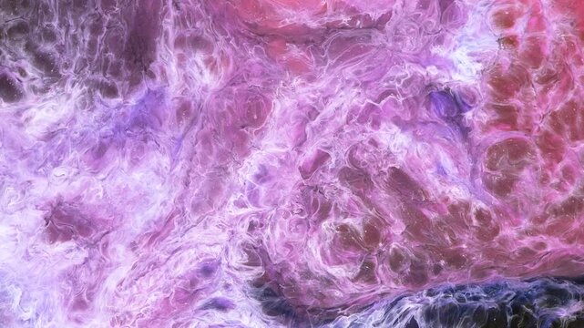 Mixing different colors of alcohol ink in a close-up view