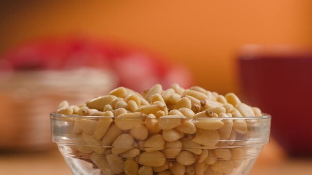 Pine Nuts Eaten by a Man, Person Cracking and Enjoying Fresh Cedar Pine Nuts as a Healthy Organic Snack