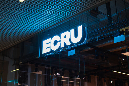  ECRU store sign is prominently displayed in a bustling commercial space.