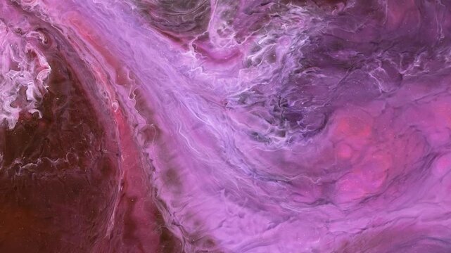 Mixing different colored alcohol inks in a close-up view