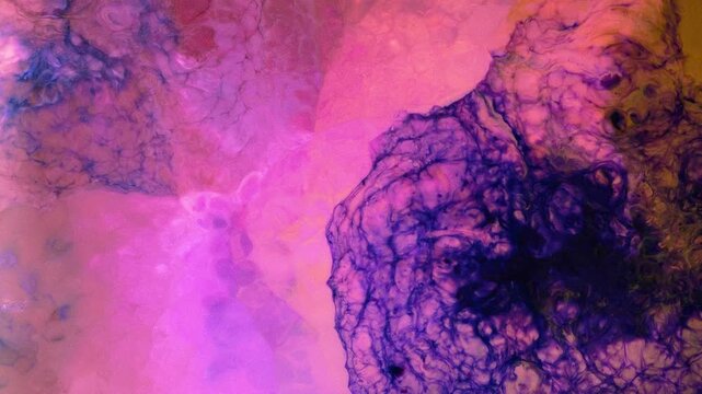 Mixing different colored alcohol inks on a smooth surface