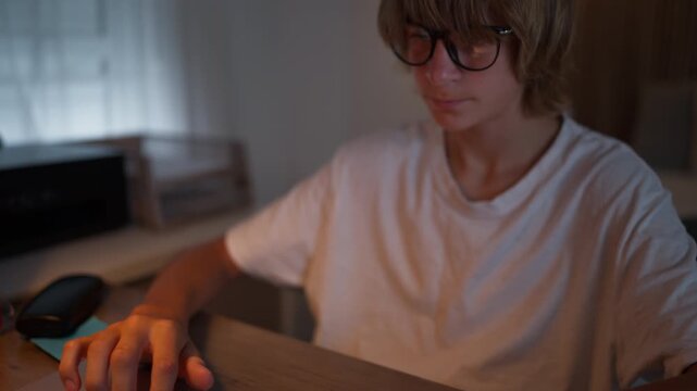 Young student studying and developing new skills with a laptop and notebook at home. Personal development, education, knowledge, self-improvement and future growth concept.