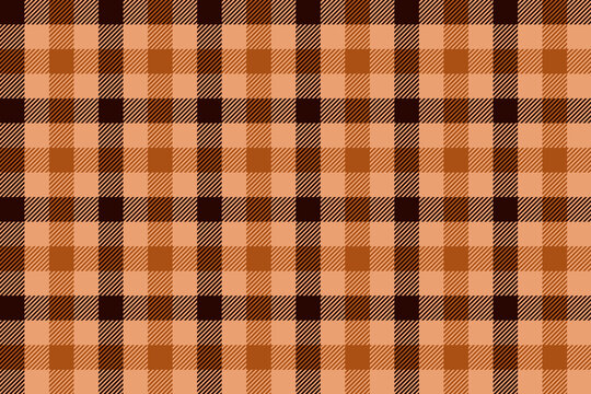 Seamless autumn fall plaid pattern in orange, tan and brown for thanksgiving decor, packaging