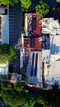 Aerial view of urban buildings with solar panels on the roof