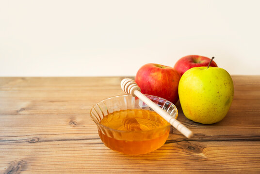 Rosh Hashanah Jewish New Year with Apples and Honey, Shana Tova Umetuka Sweet Year Tradition, Blessing and Holiday Greeting