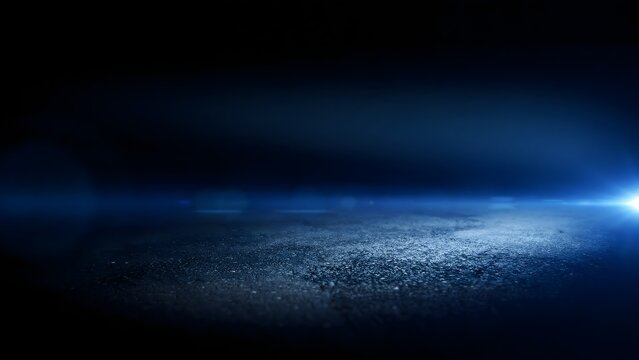 Abstract blue light flare on dark textured surface for technology background