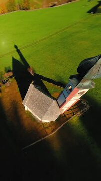 FPV Aerial view of the Church of St. Johann in Ranui at South Tyrol, Italy. 