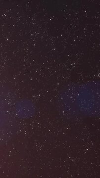 Animation of glowing light spots and snow falling over black background