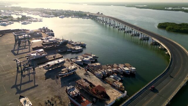 Aerial view of Chuburna fishing port and curved bridge in Yucatan